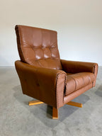 1970’s Danish Caramel Cowboy Leather and Beech Swivel Lounge Chair Pair