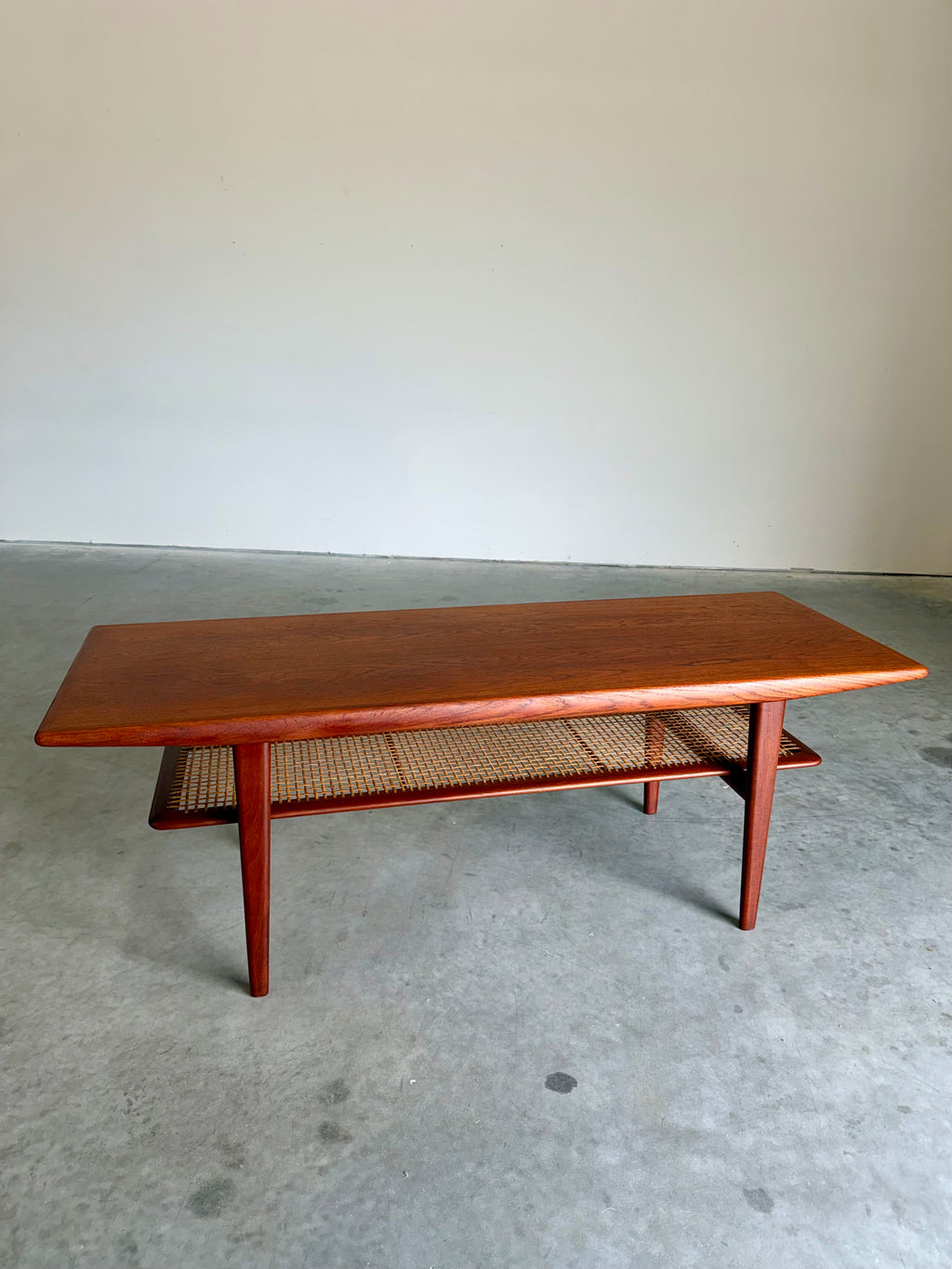 Mid Century Danish Teak and Cane Coffee Table with Magazine Rack
