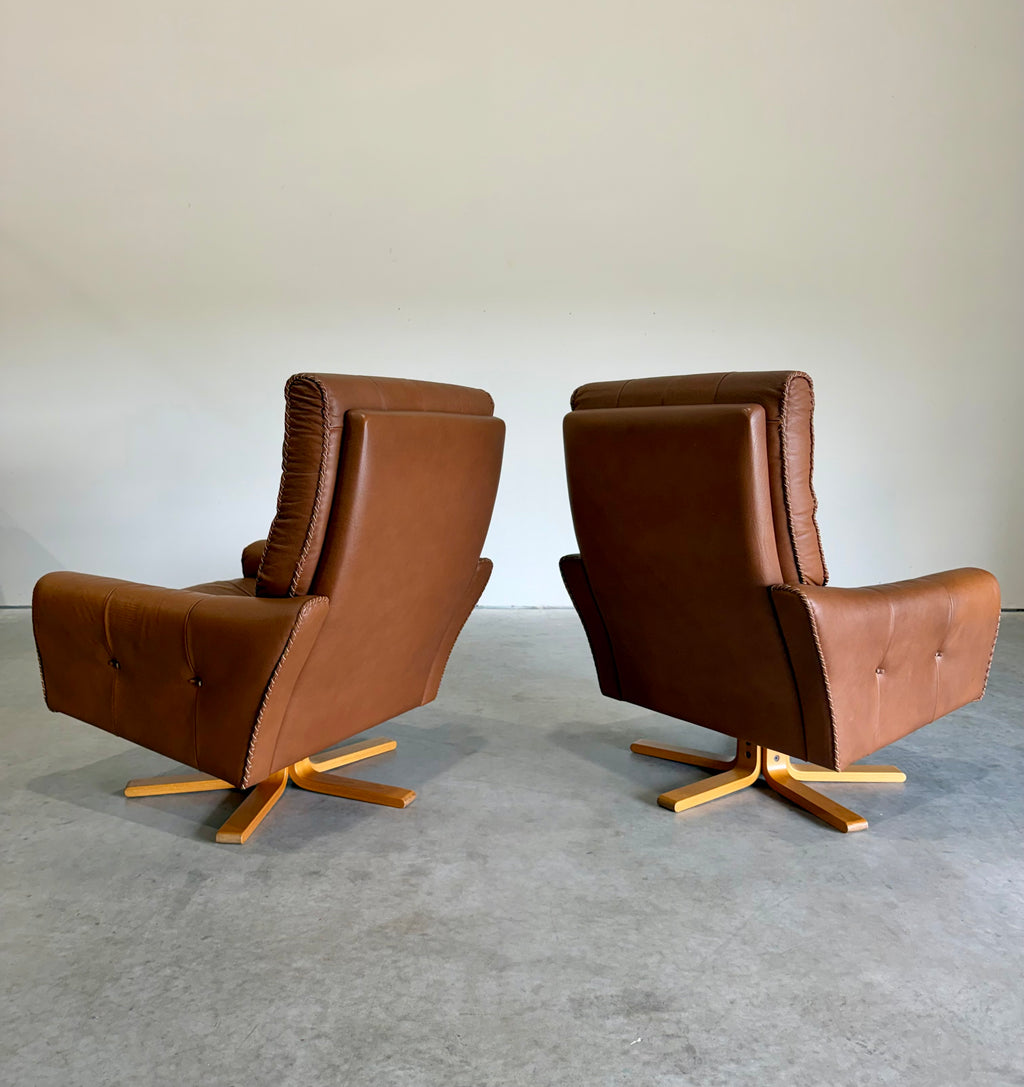 1970’s Danish Caramel Cowboy Leather and Beech Swivel Lounge Chair Pair