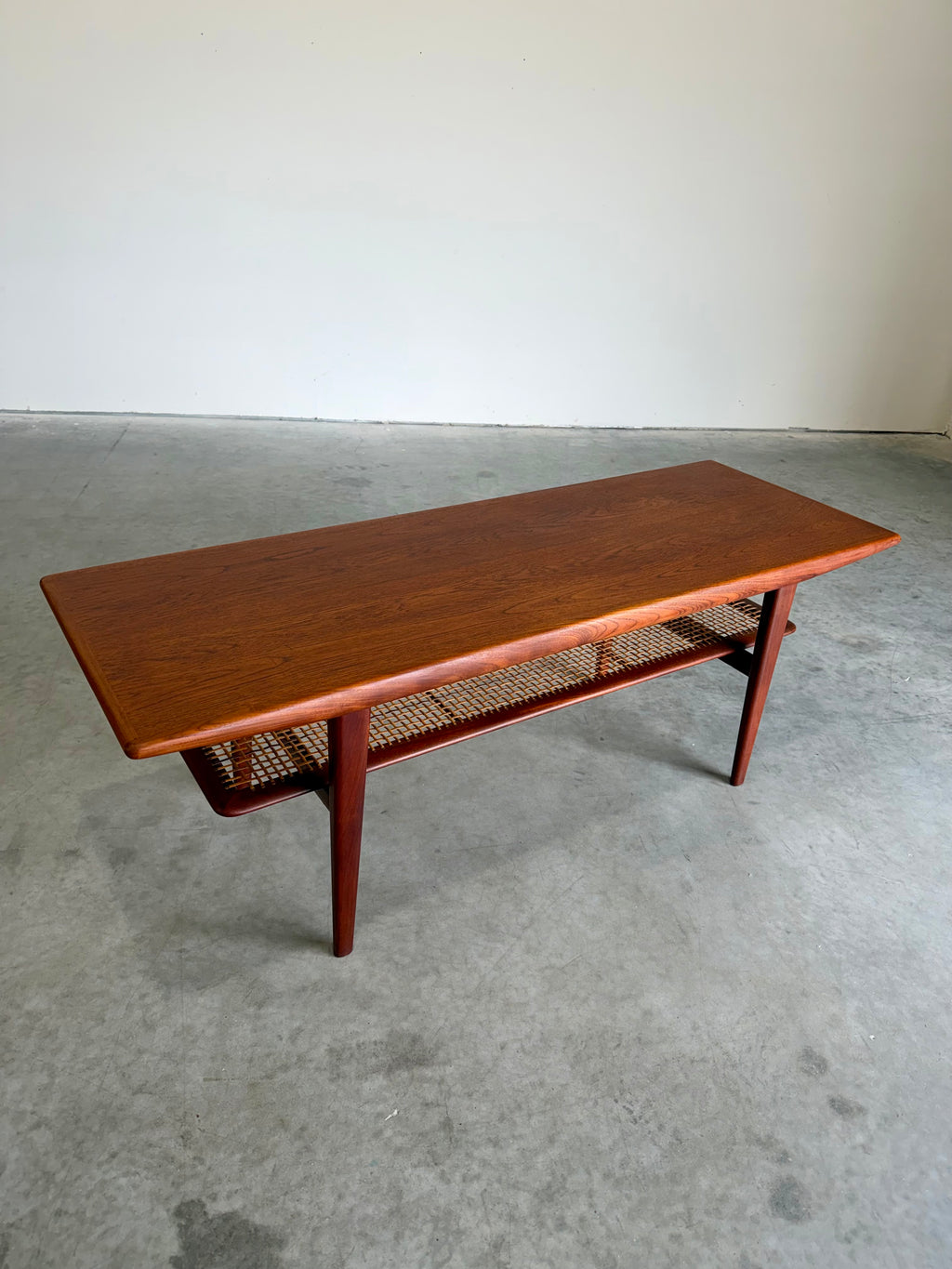 Mid Century Danish Teak and Cane Coffee Table with Magazine Rack