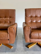 1970’s Danish Caramel Cowboy Leather and Beech Swivel Lounge Chair Pair