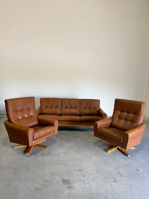 1970’s Danish Caramel Cowboy Leather and Beech Swivel Lounge Chair Pair