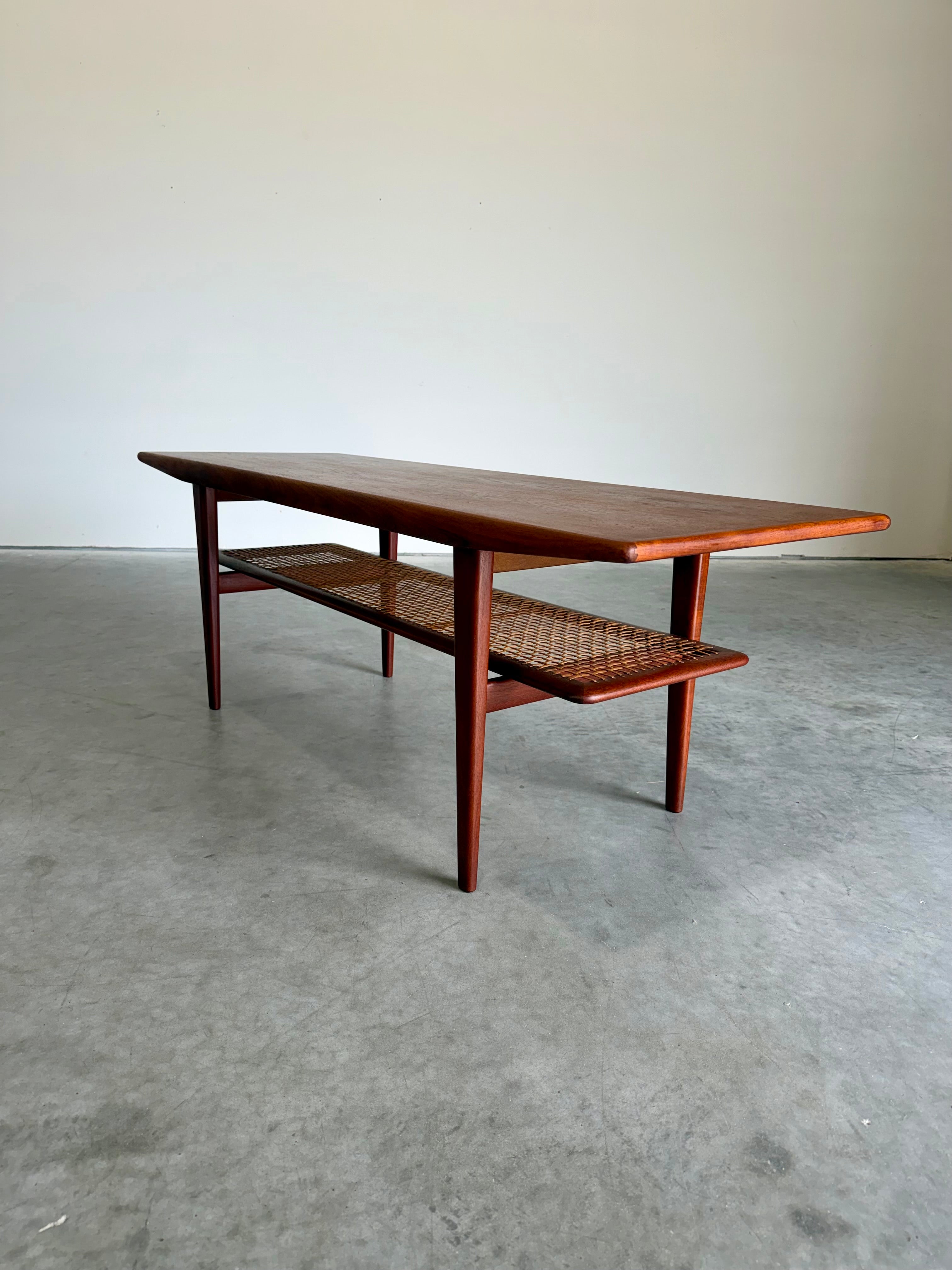 Mid Century Danish Teak and Cane Coffee Table with Magazine Rack