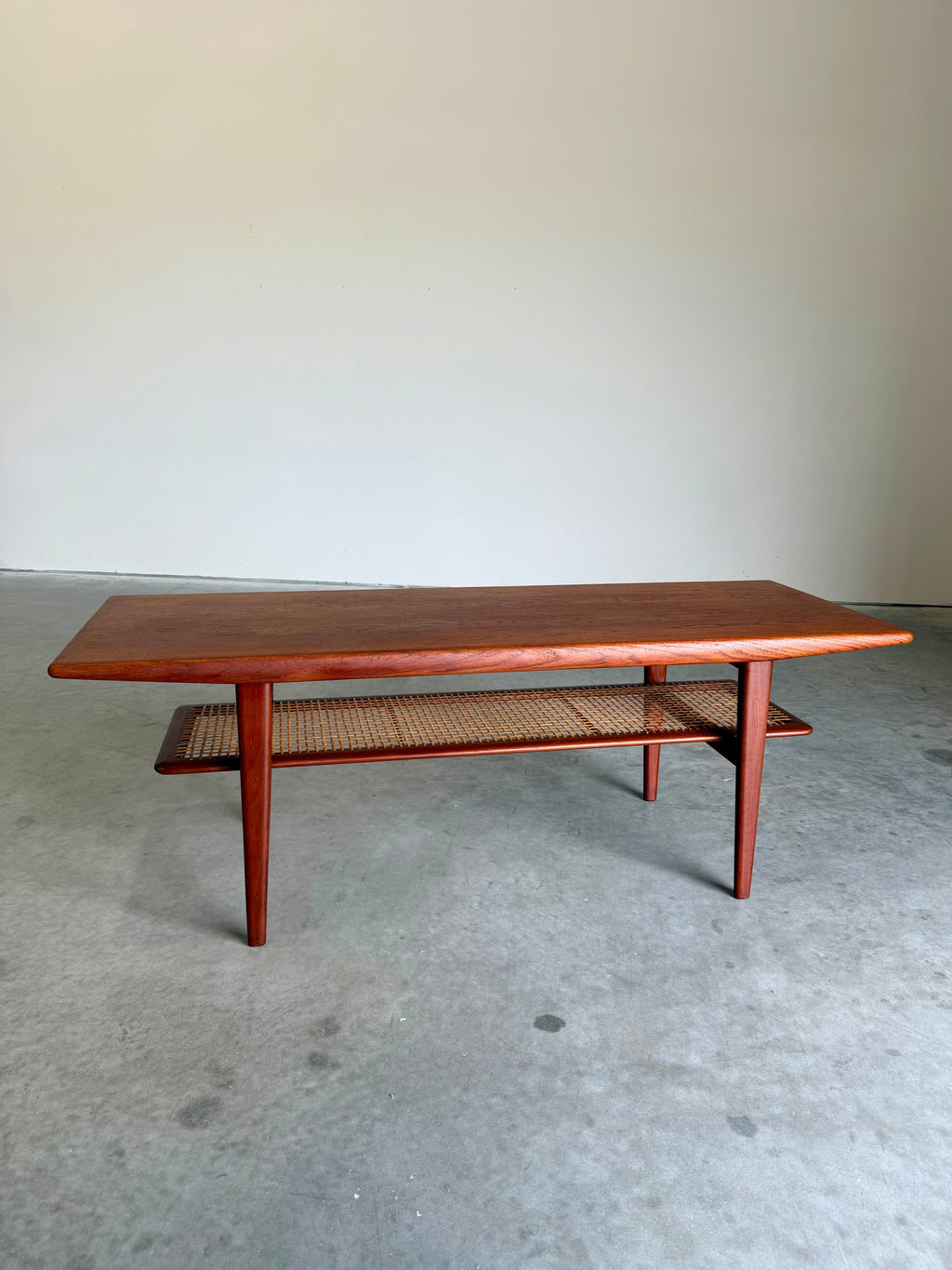 Mid Century Danish Teak and Cane Coffee Table with Magazine Rack